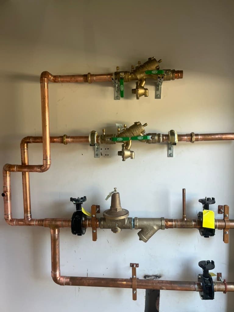 Copper piping with brass valves installed by MRJ Plumbing in Asheville, NC